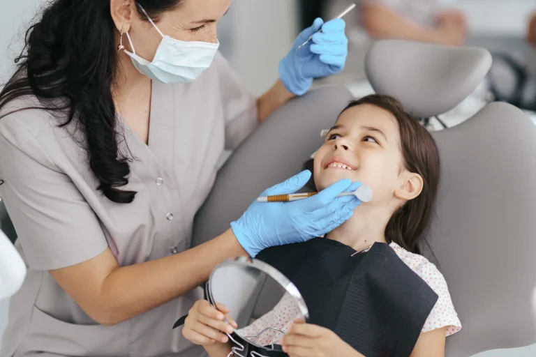 Young girl smiling during dental checkup with dentist at SpringLake Dental in Woodland, CA