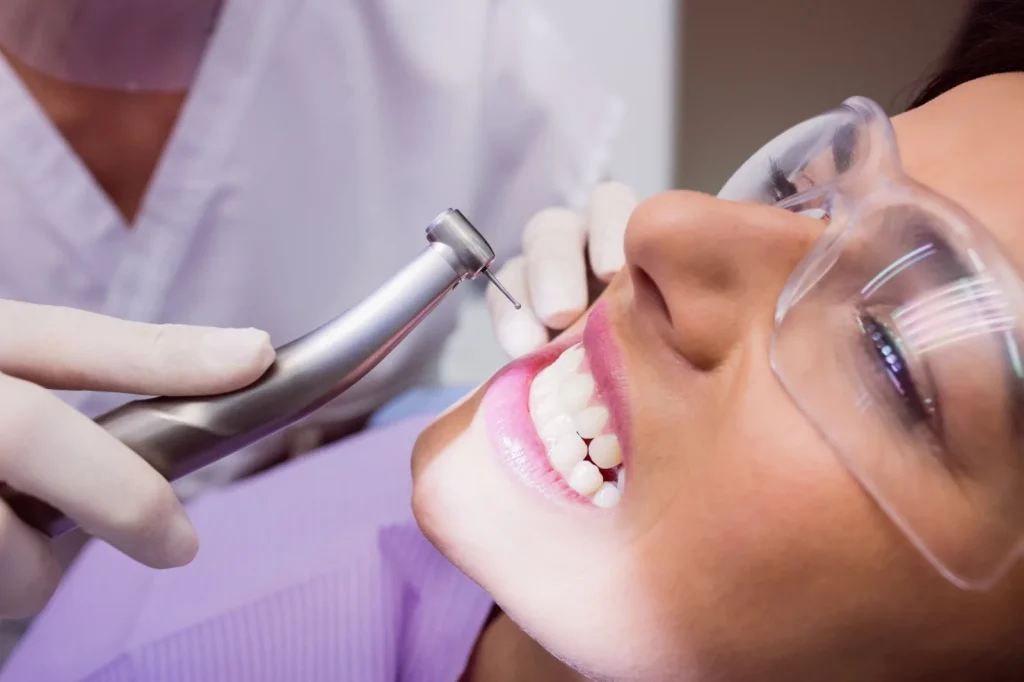 Patient receiving a gentle dental exam and cleaning at a dentist in Woodland, CA